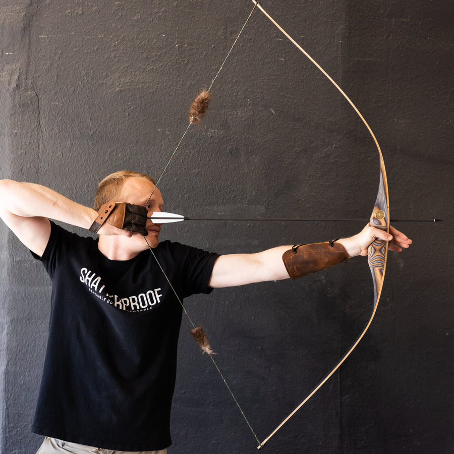 BONES Reflex-Deflex Longbow — longbow at full draw