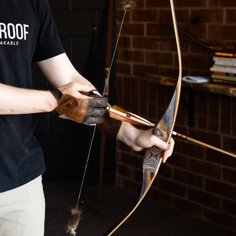 BONES Reflex-Deflex Longbow — archer holding strung longbow