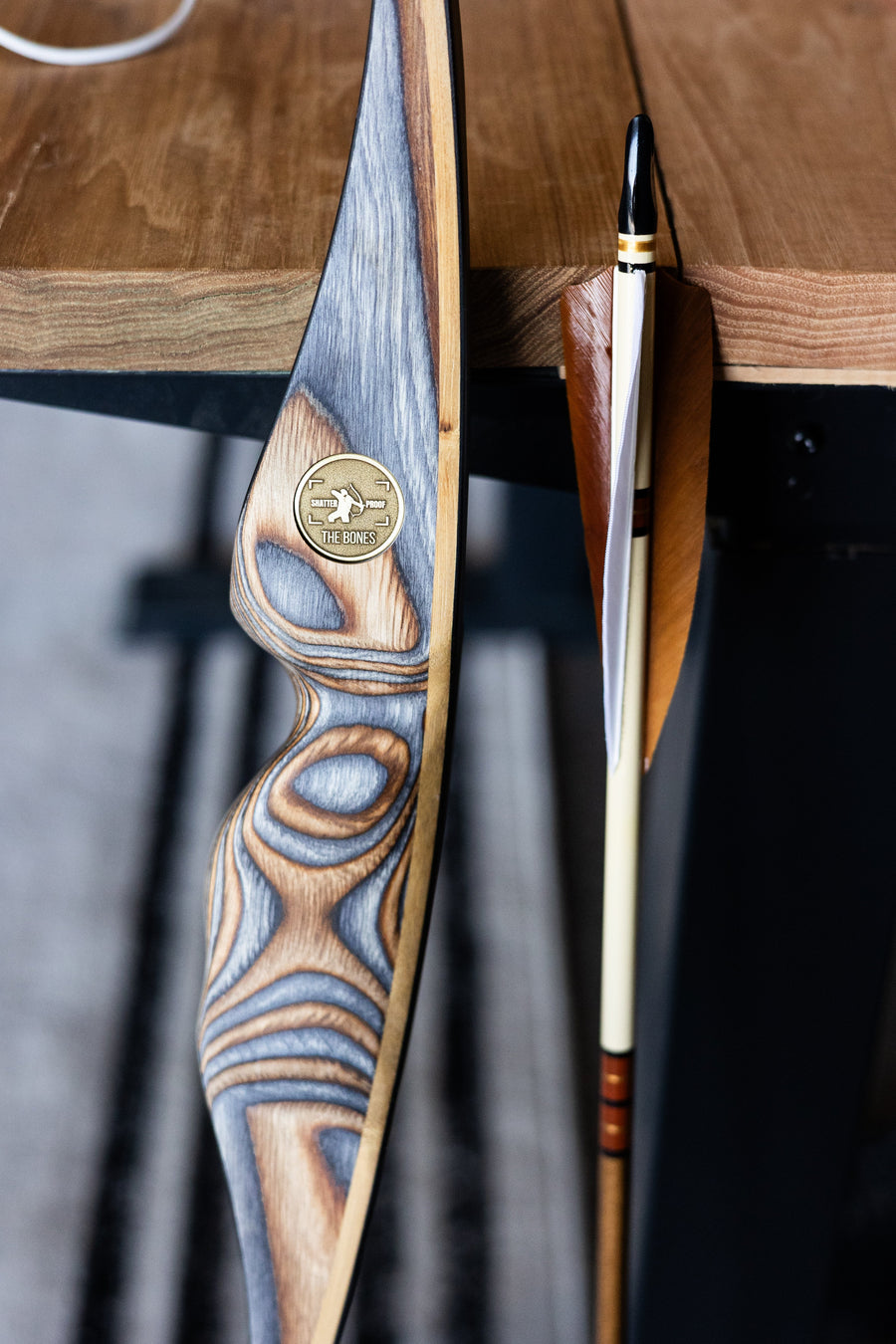 USA-Made Western Larch Wood Arrows — wood arrow resting on bow shelf