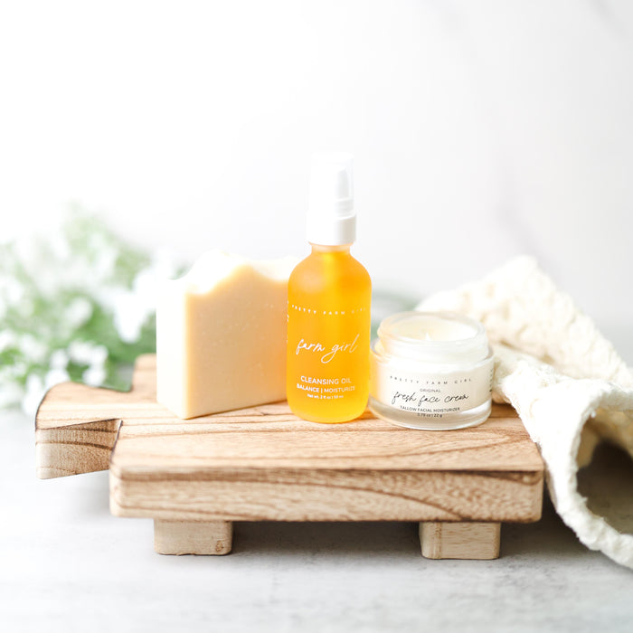 Fresh Face cream, soap and cleansing oil on a wooden tray