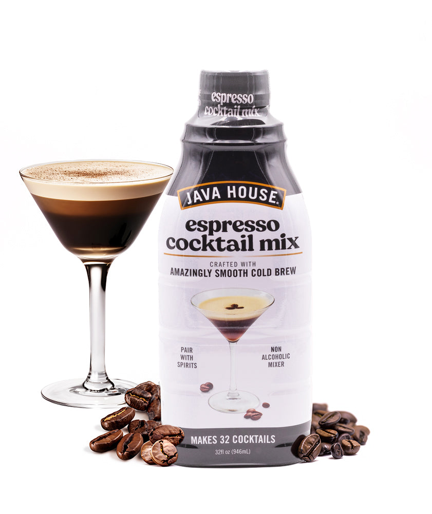 Espresso martini mix bottle beside a prepared cocktail