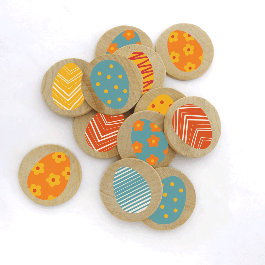 Eight wooden Easter egg tokens with colorful printed patterns