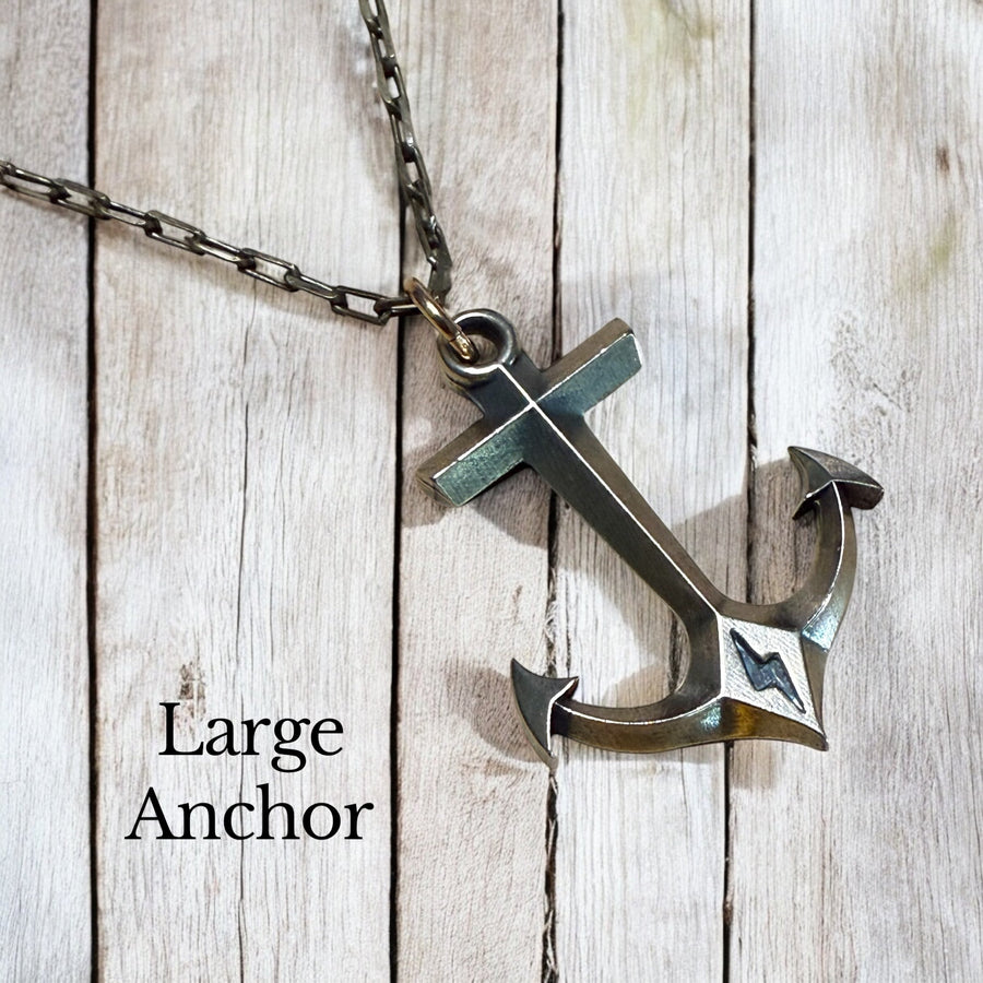 Large Hold Fast Anchor pendant against wood