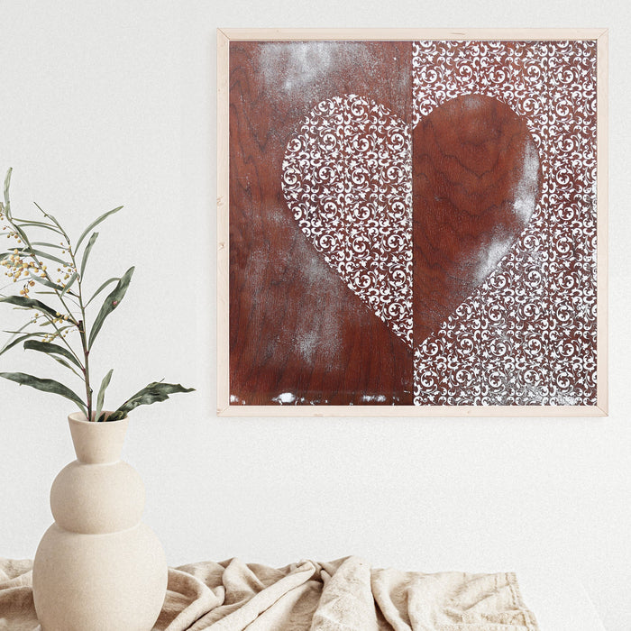 Heart of Filigree art print with a pale ornamental heart against brown wood imagery.