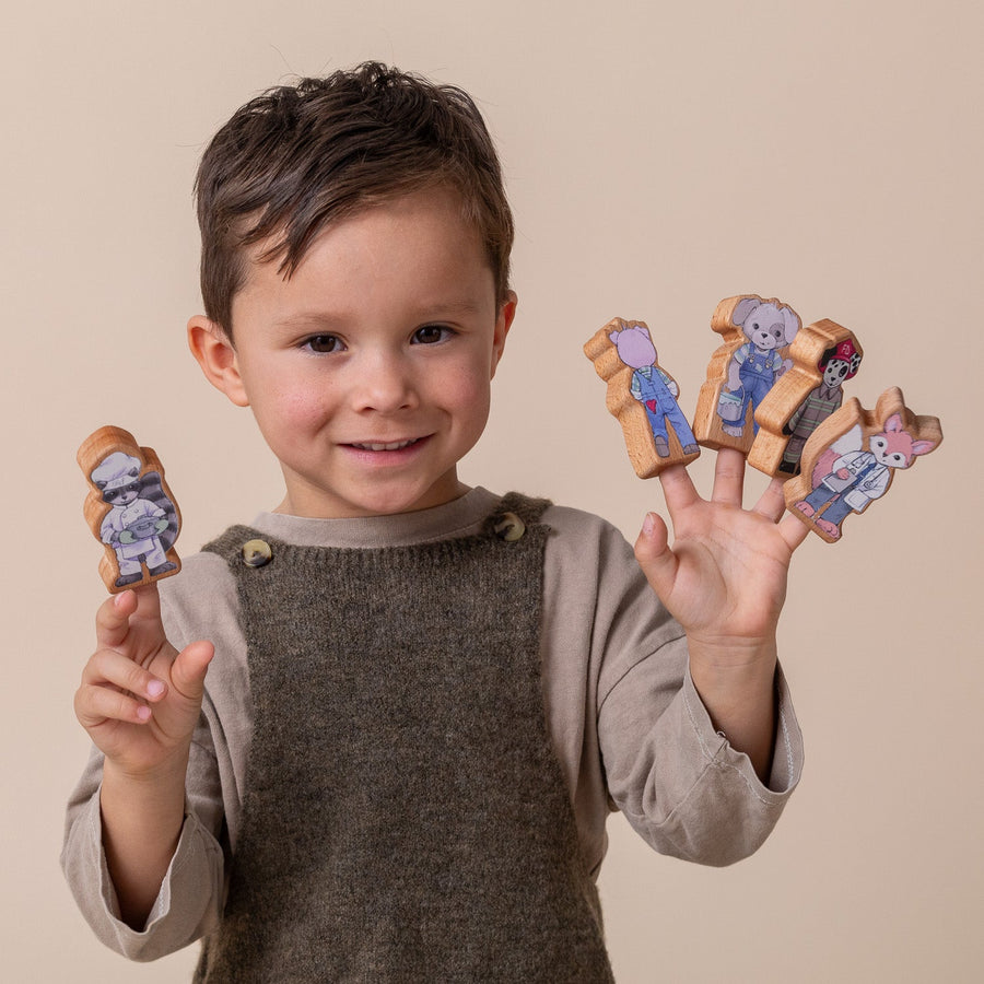 Children using wooden finger puppet characters for storytelling