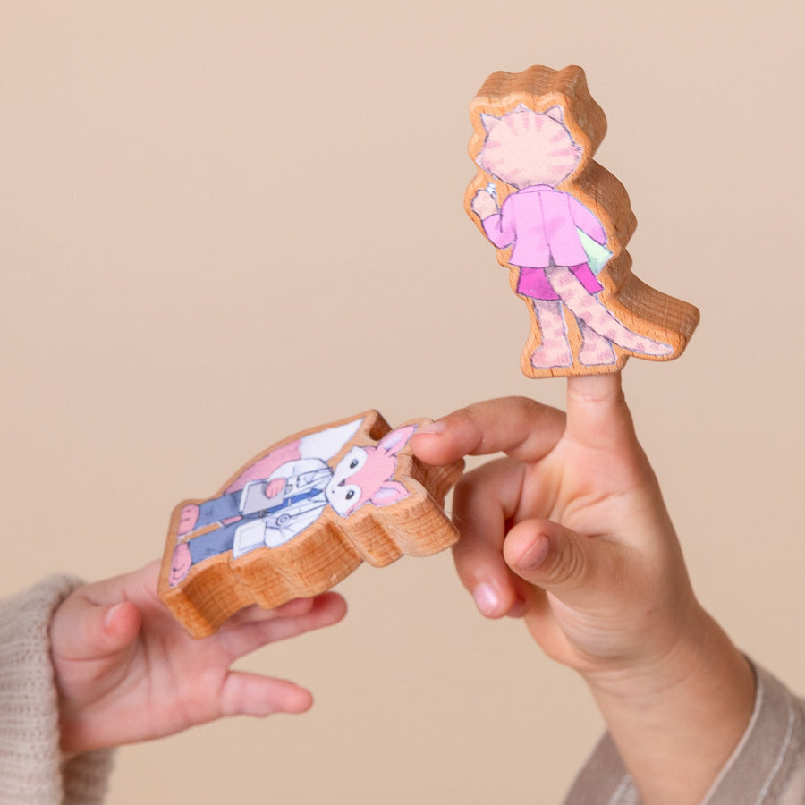 Children using wooden finger puppet characters for storytelling