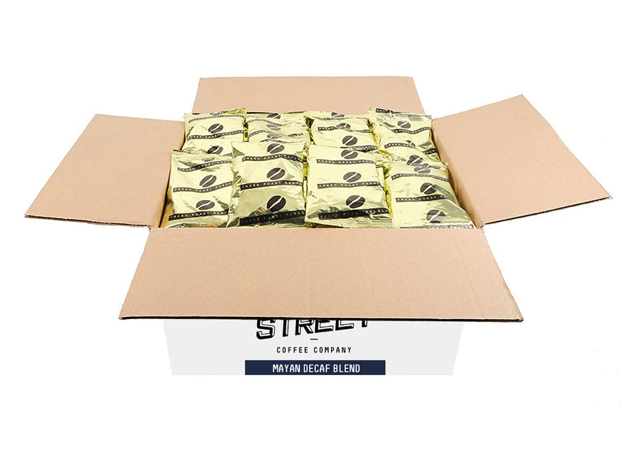 Open carton of Mayan Decaf coffee portion packs