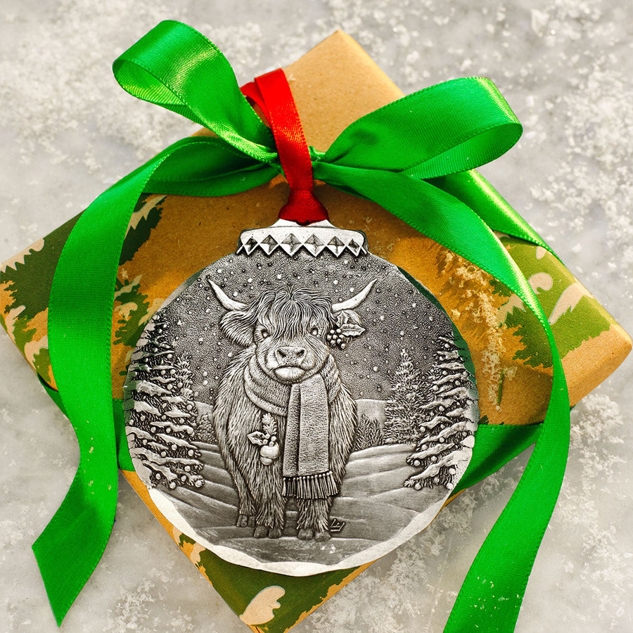 Styled display featuring Holiday Highland Cow Christmas Ornament