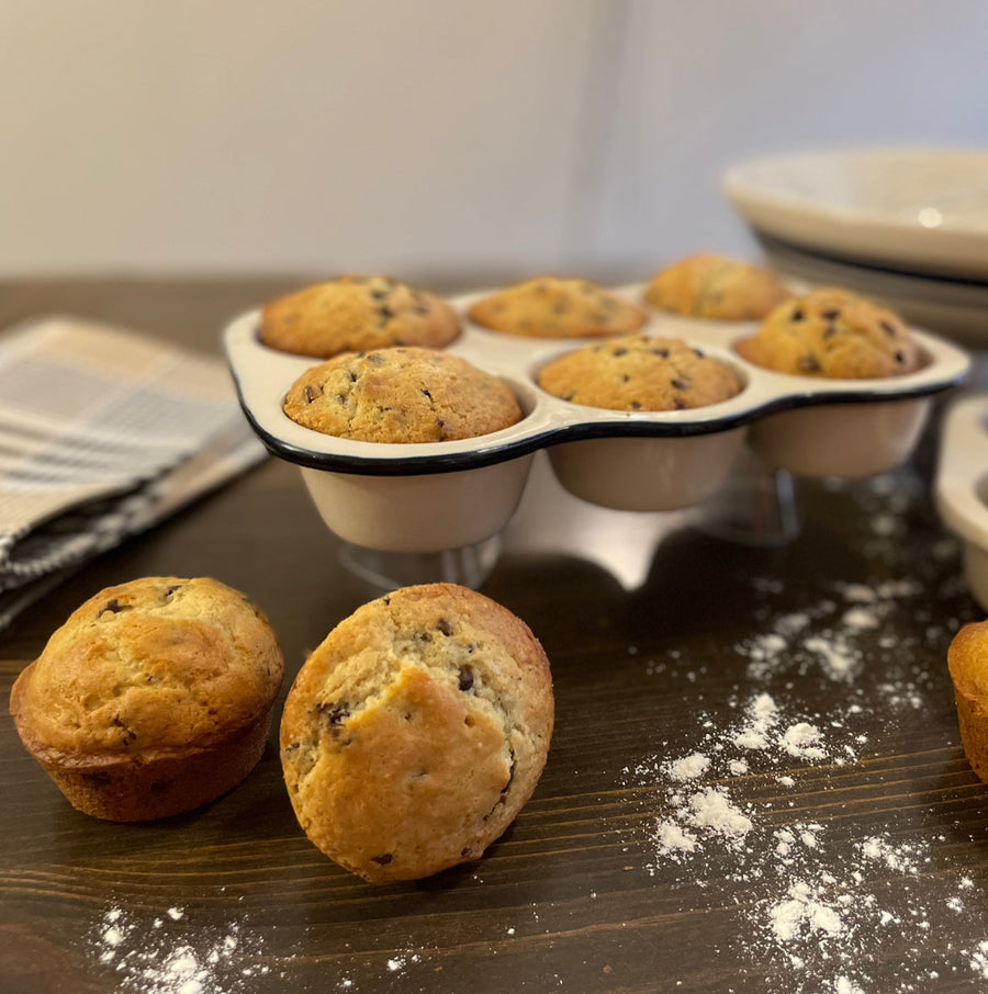 Six-cup Dominion stoneware muffin pan displayed with baked muffins