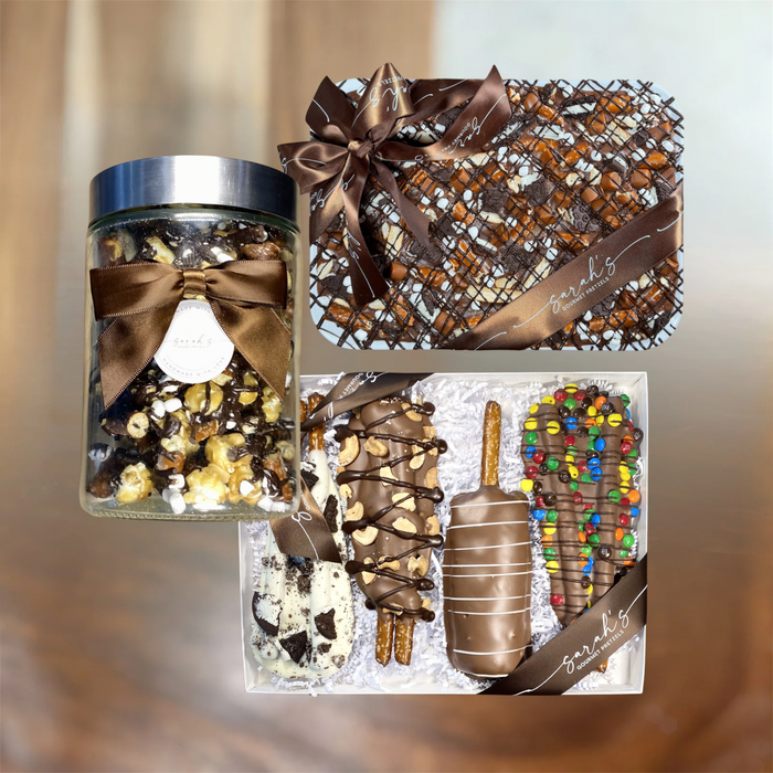 Party pack showing a popcorn jar, pretzel gift box and bark platter