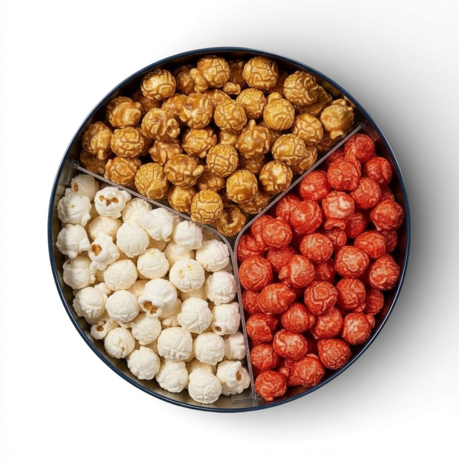 Open tin with caramel, Hot Cheddar, and butter popcorn compartments