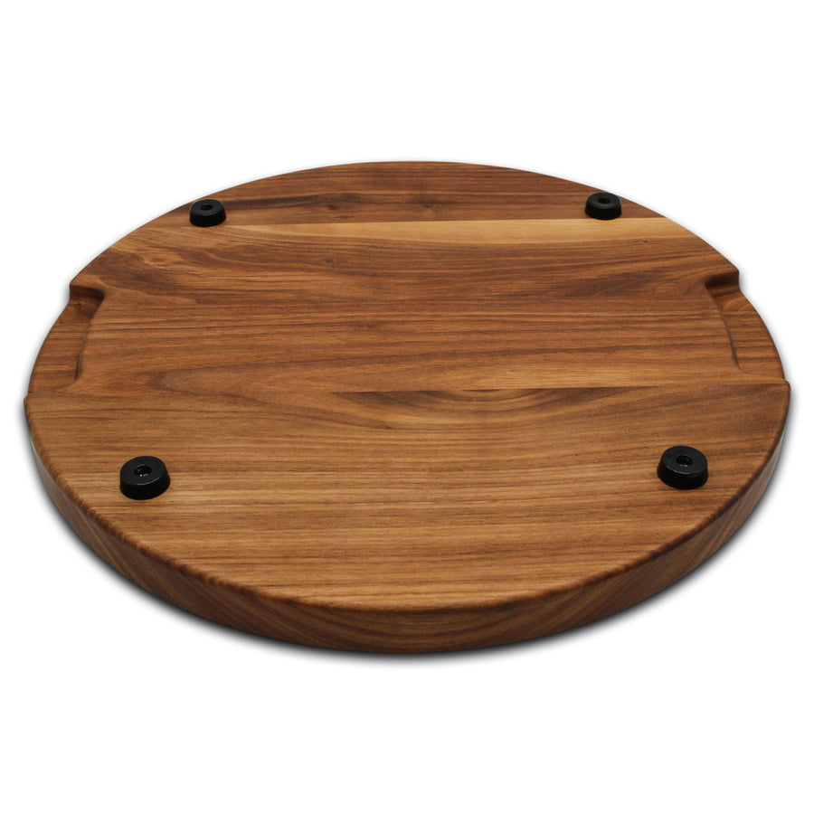 Walnut round board underside showing four rubber feet