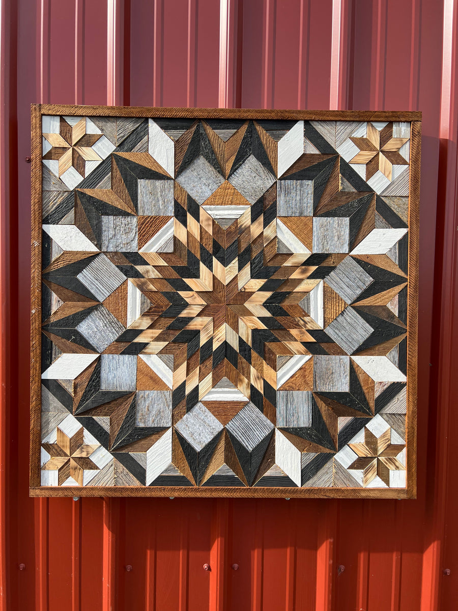 Individual reclaimed-wood barn quilt with a hand-painted geometric star design