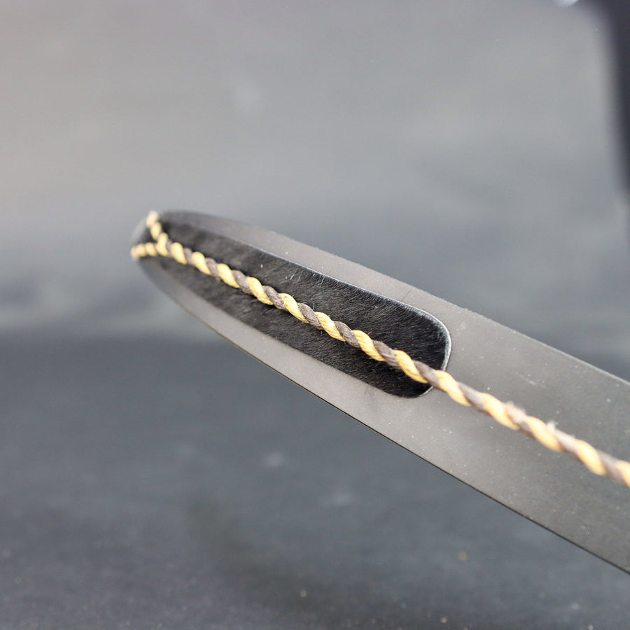 Peel-and-Stick Calf Hair Recurve String Groove Silencers — pad fitted in a recurve limb groove
