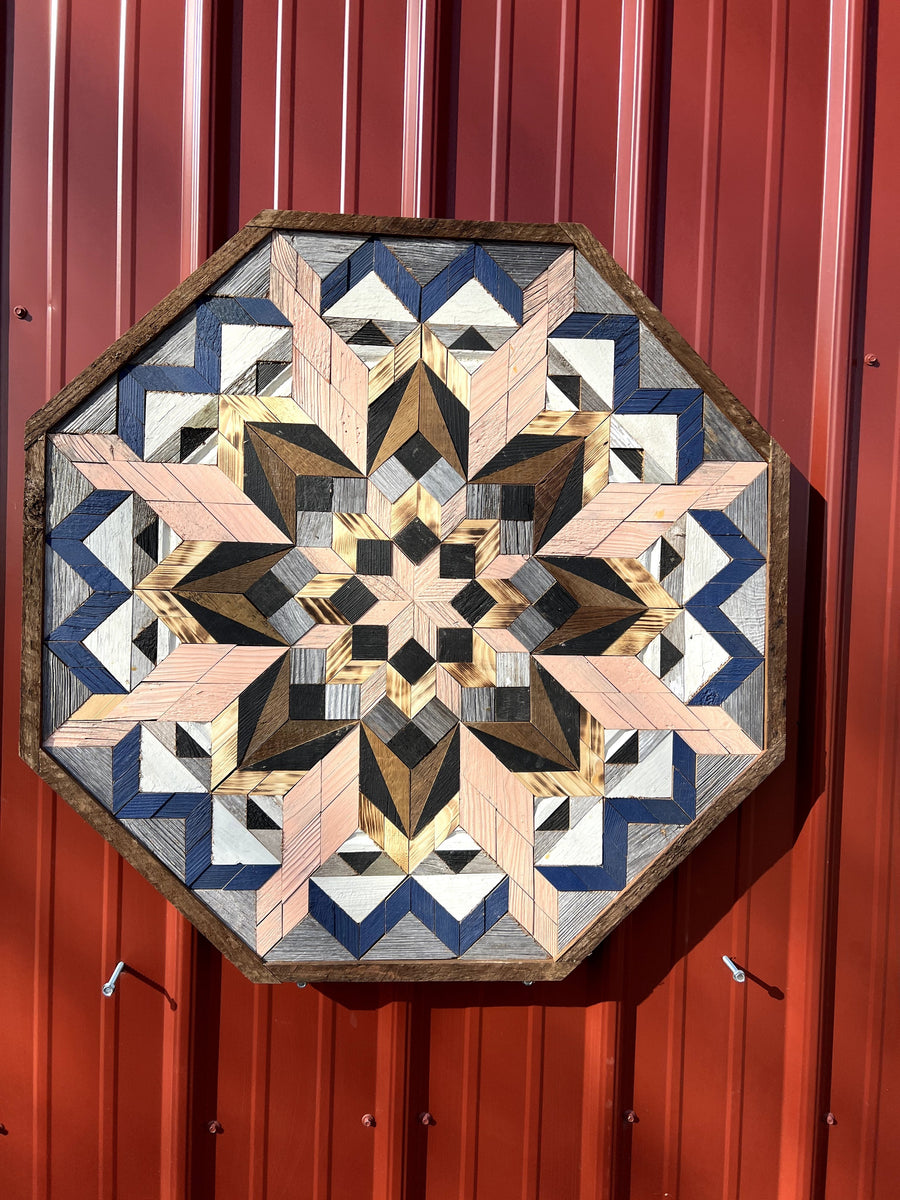 Individual reclaimed-wood barn quilt with a hand-painted geometric star design