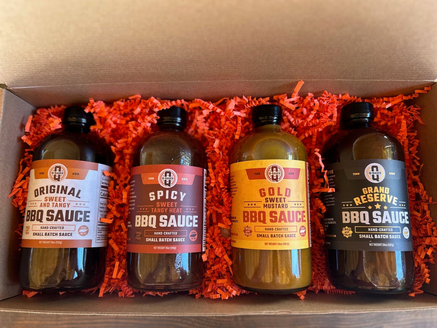 Whole Hog gift box open with Original, Spicy, Gold and Grand Reserve sauces