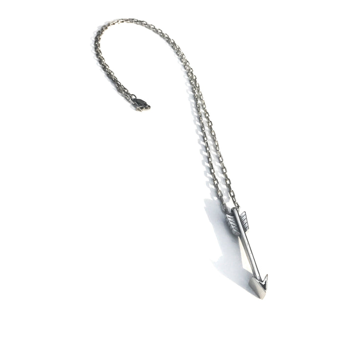 Arrow of Courage necklace on chain against white