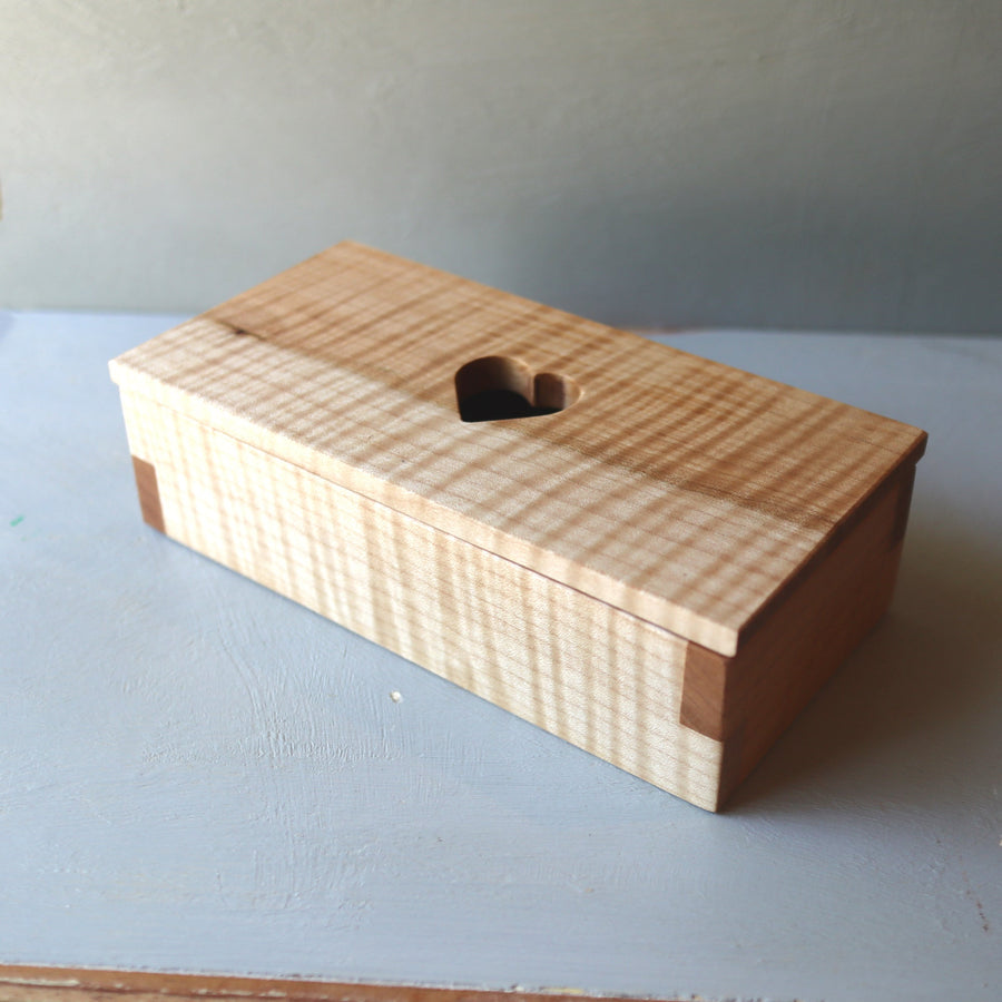 Hardwood keepsake box with a heart-shaped opening in the lid.