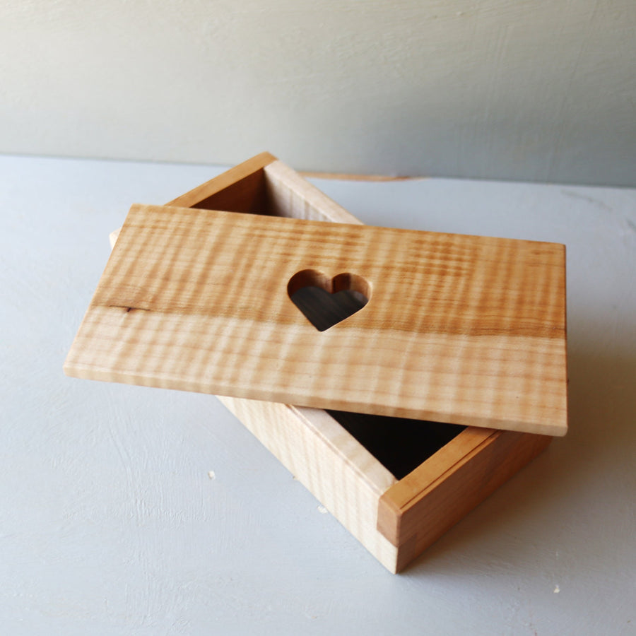 Hardwood keepsake box with a heart-shaped opening in the lid.