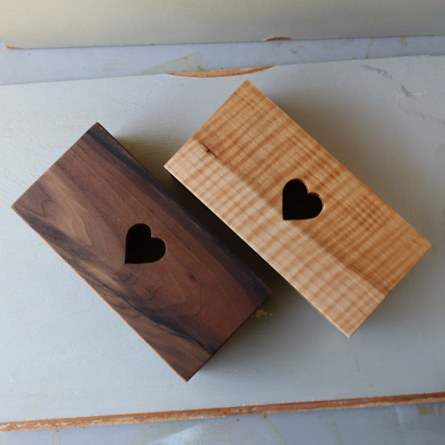 Hardwood keepsake box with a heart-shaped opening in the lid.