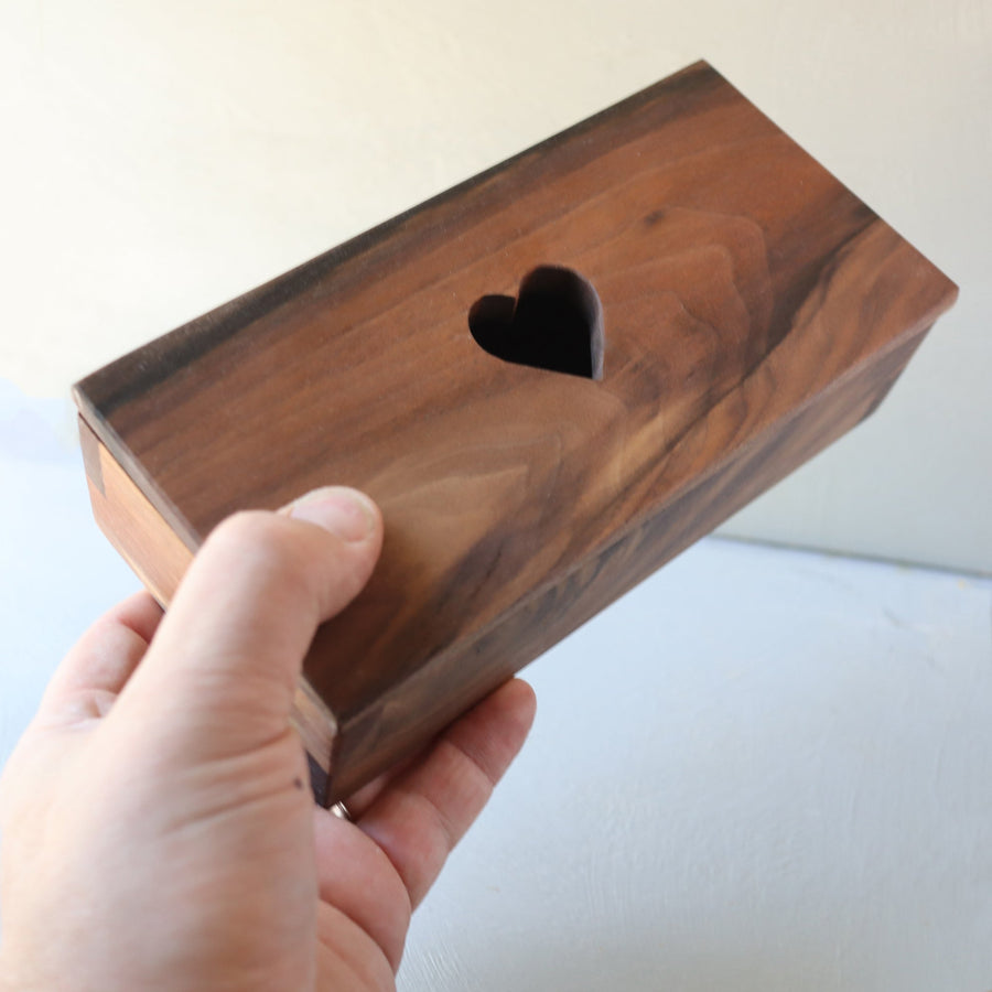 Hardwood keepsake box with a heart-shaped opening in the lid.