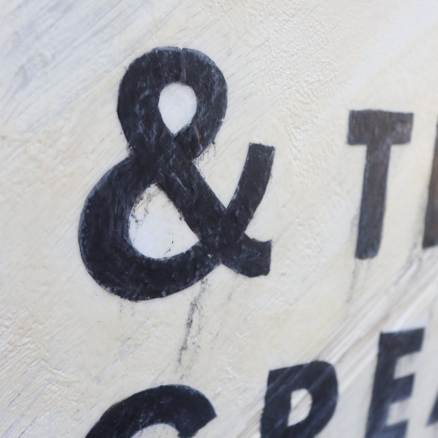 The Greatest of These Is Love art print with bold black lettering.