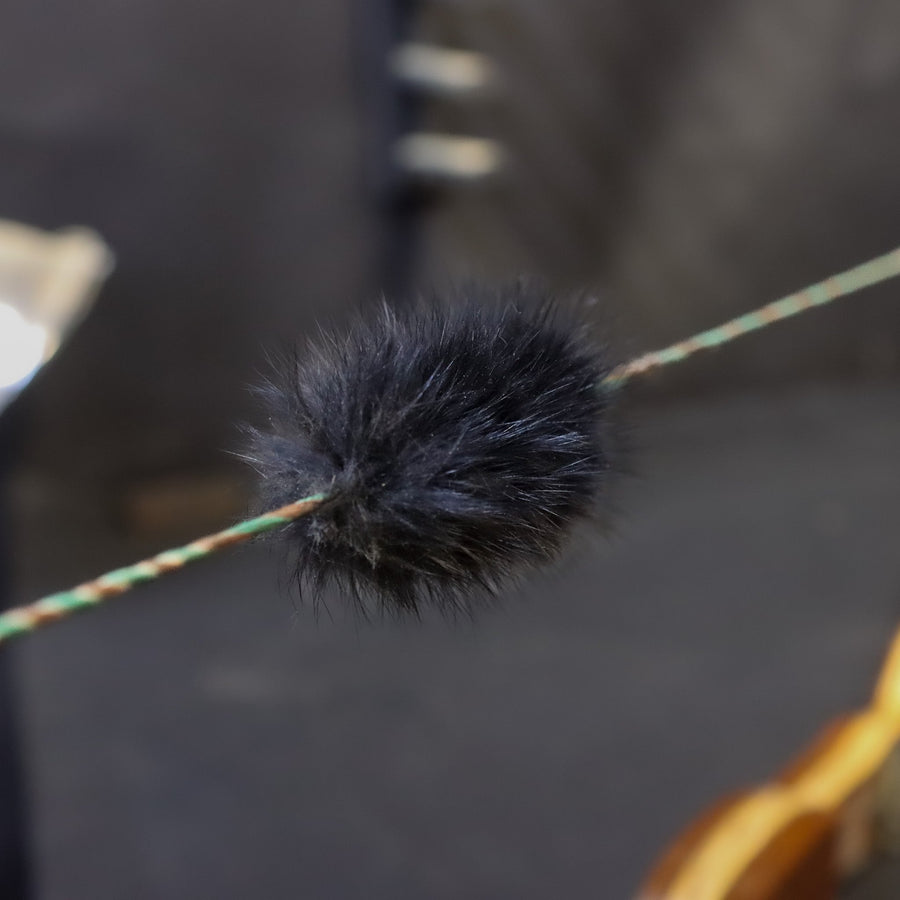 Black Rabbit Fur Bowstring Silencers — fur silencer on strung bow