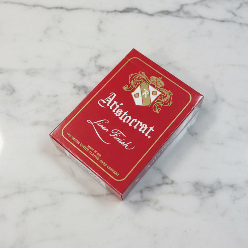 Crimson Aristocrat 727 tuck box on pale marble