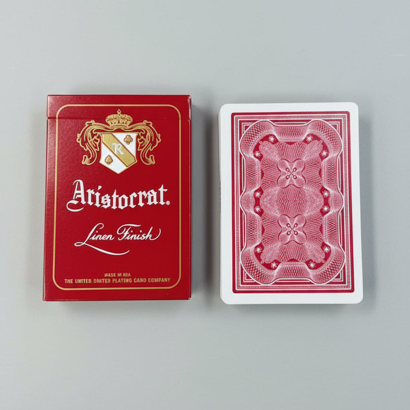 Crimson Aristocrat tuck beside a matching card back