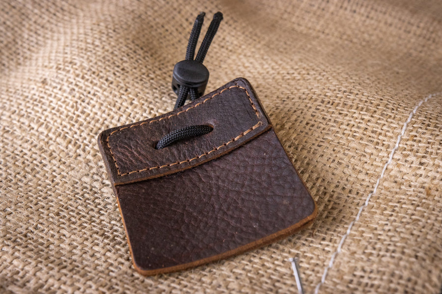 3-Under Leather Archery Tab — tab laid on textured fabric
