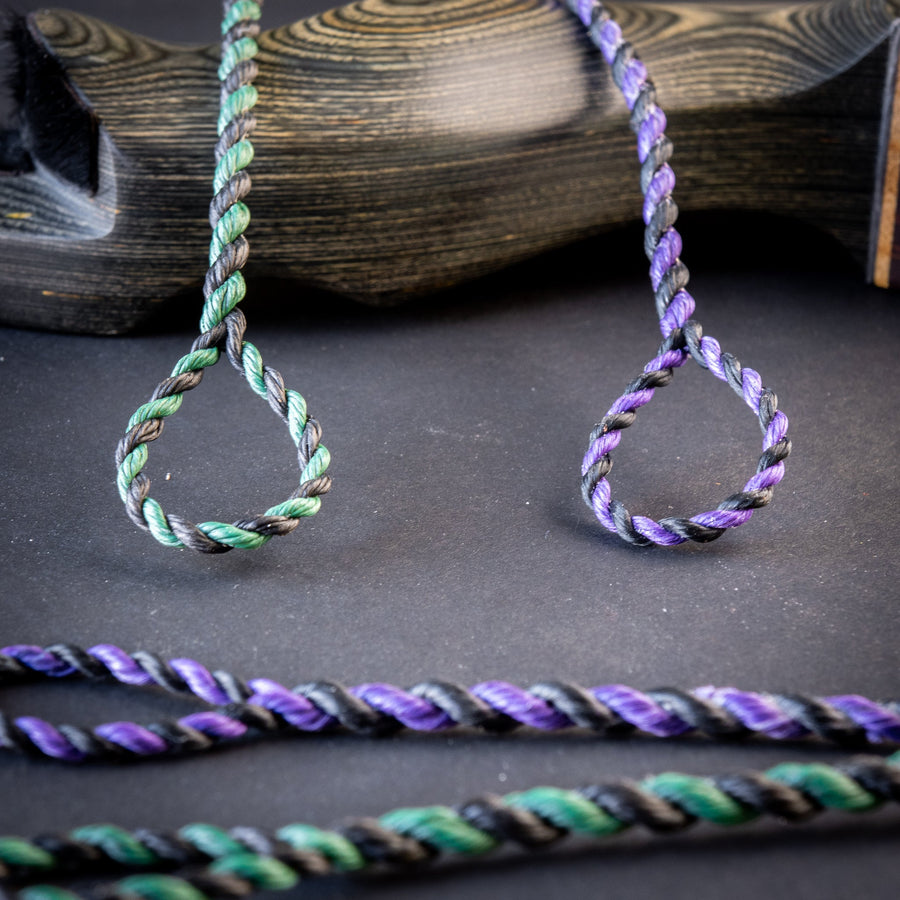 Fast Flight 652 Spectra Custom Flemish Twist Bowstring — colored loops beside fiber spools