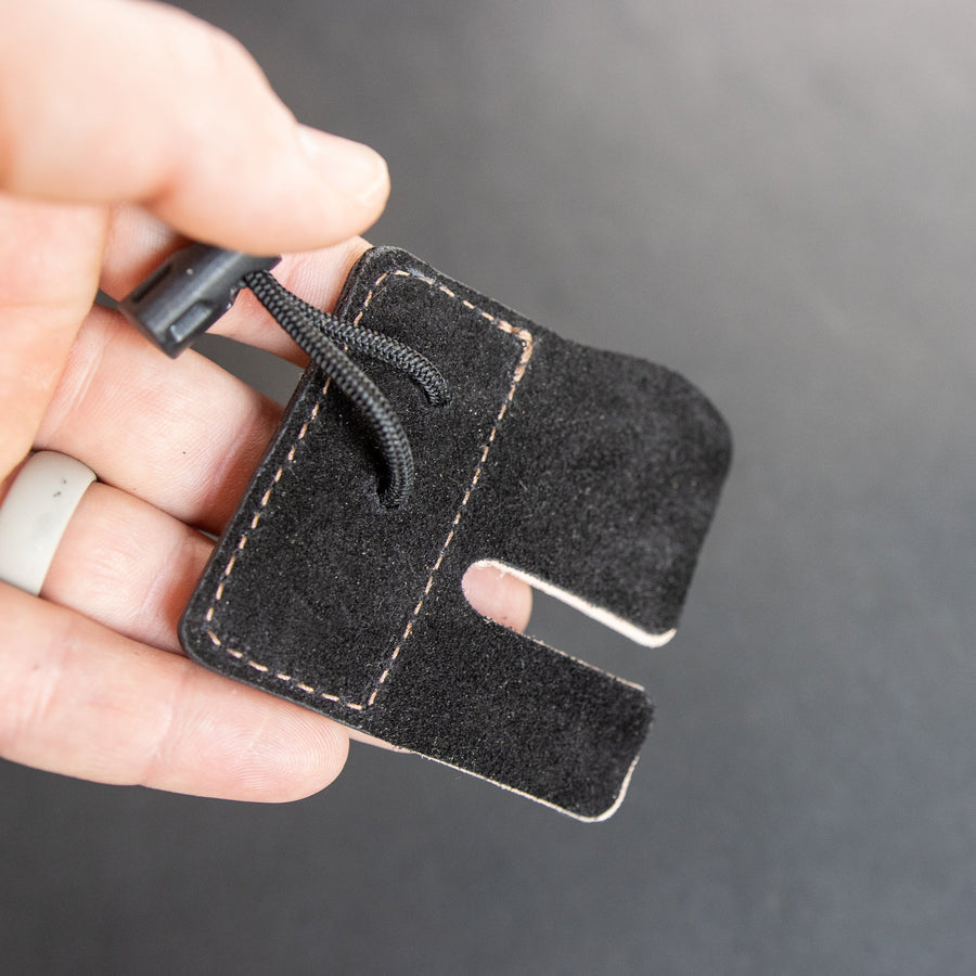 Shell Cordovan Split-Finger Archery Tab — reverse side and adjustable cord