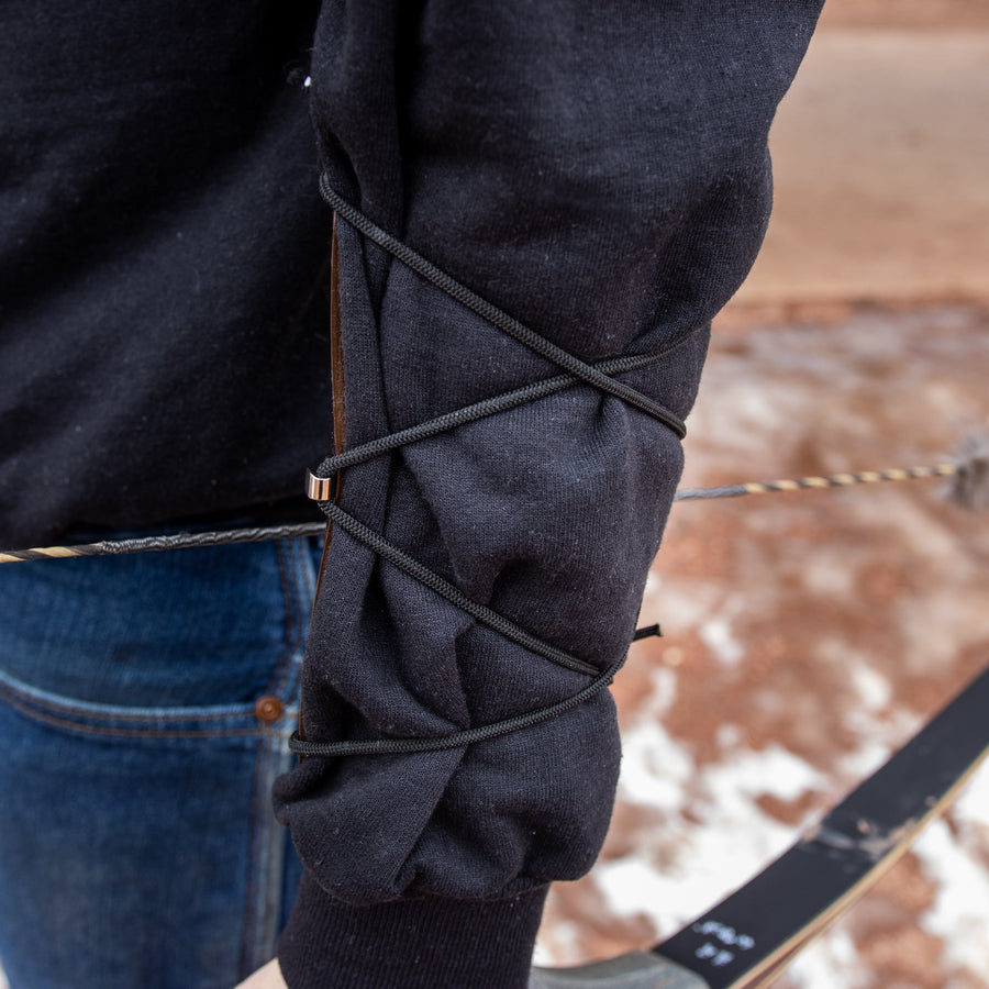 Essential Leather Archery Arm Guard — leather guard covering forearm