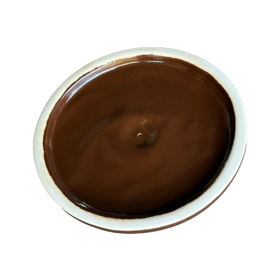 Underside of the brown glazed bean-pot lid
