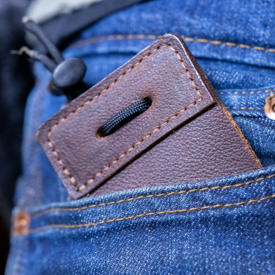 3-Under Leather Archery Tab — tab stored in clothing pocket