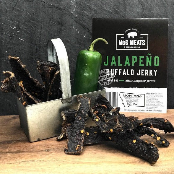 Jalapeño Buffalo Jerky, strips beside a jalapeño and display card