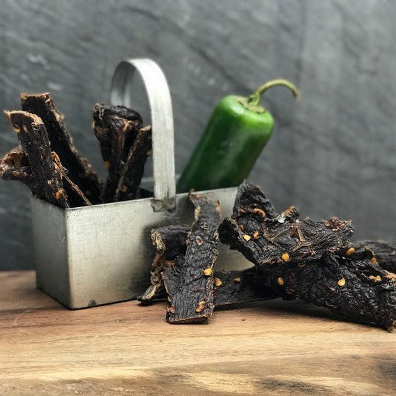 Jalapeño Buffalo Jerky, close-up of strips in a metal carrier