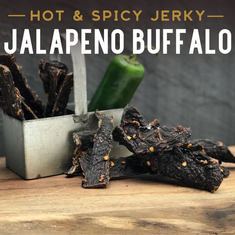Jalapeño Buffalo Jerky, promotional photo with a jalapeño and dried strips
