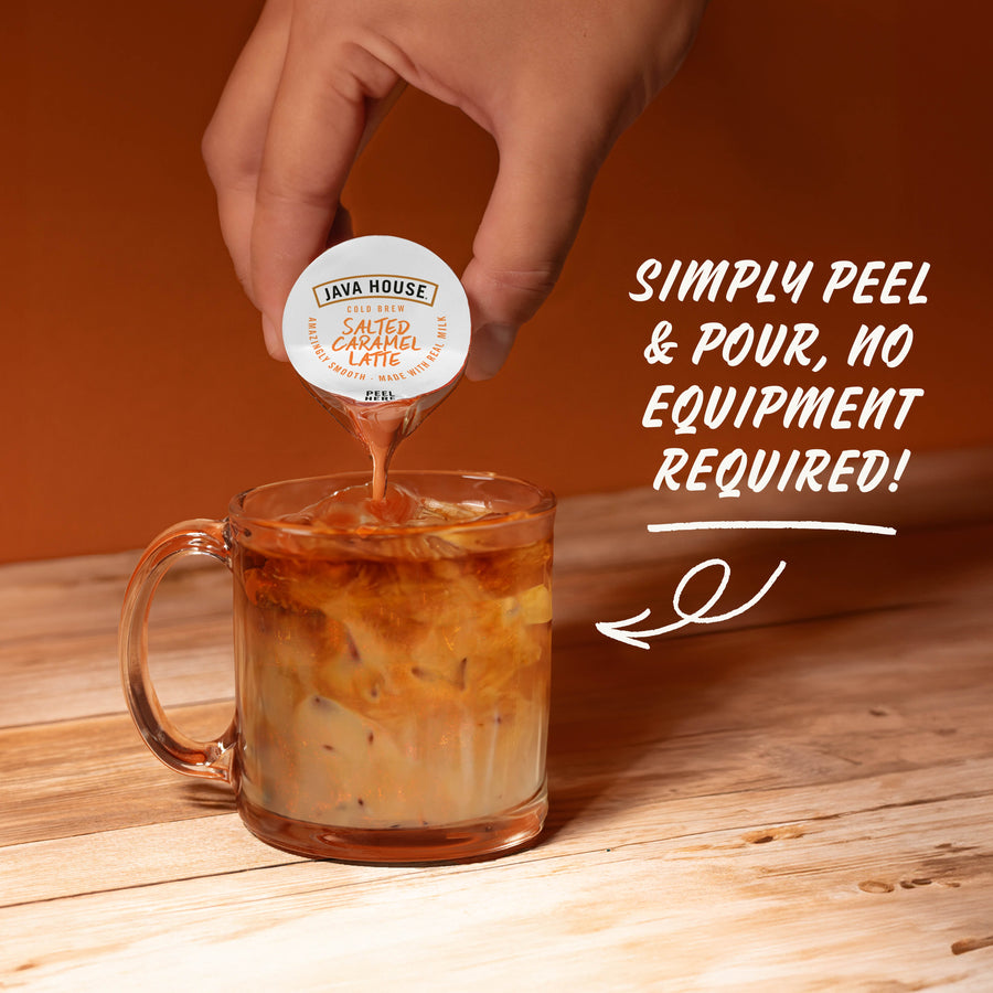 Hand pouring Salted Caramel latte concentrate over ice