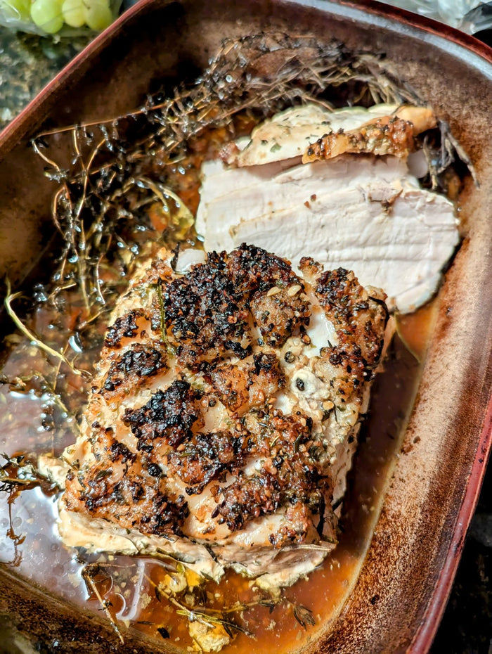 Sliced seasoned roast illustrating a Kick Ur Butt Rub serving idea
