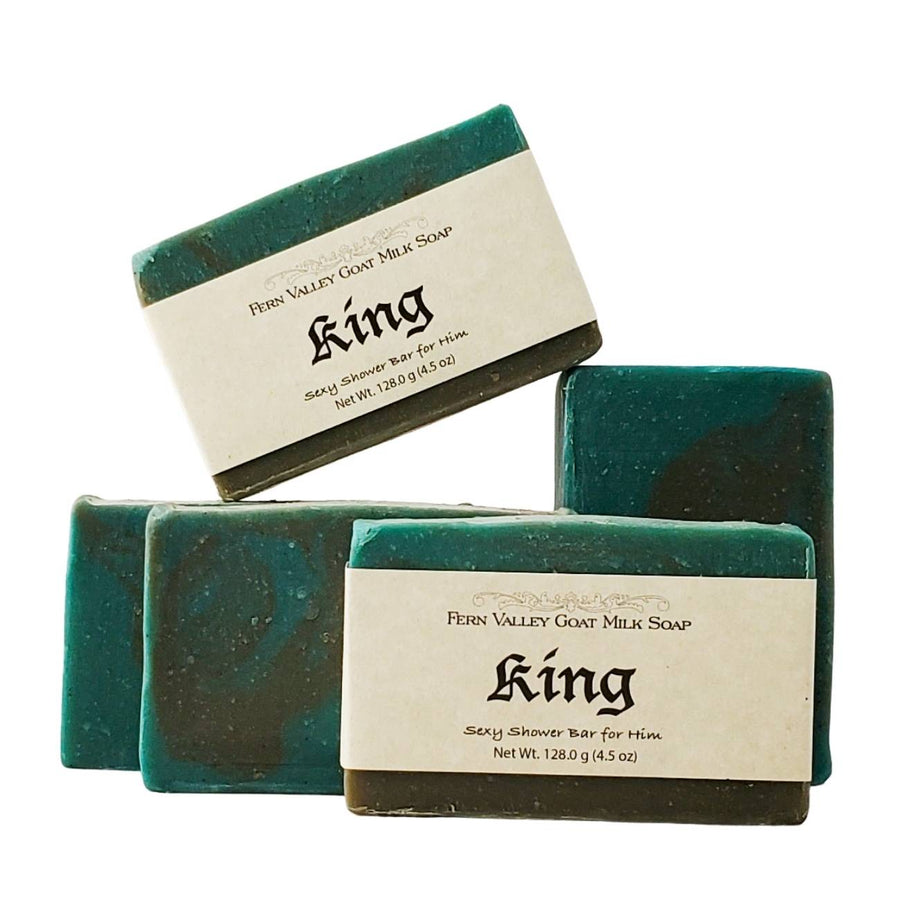 King goat milk soap — three labelled bars arranged at angles
