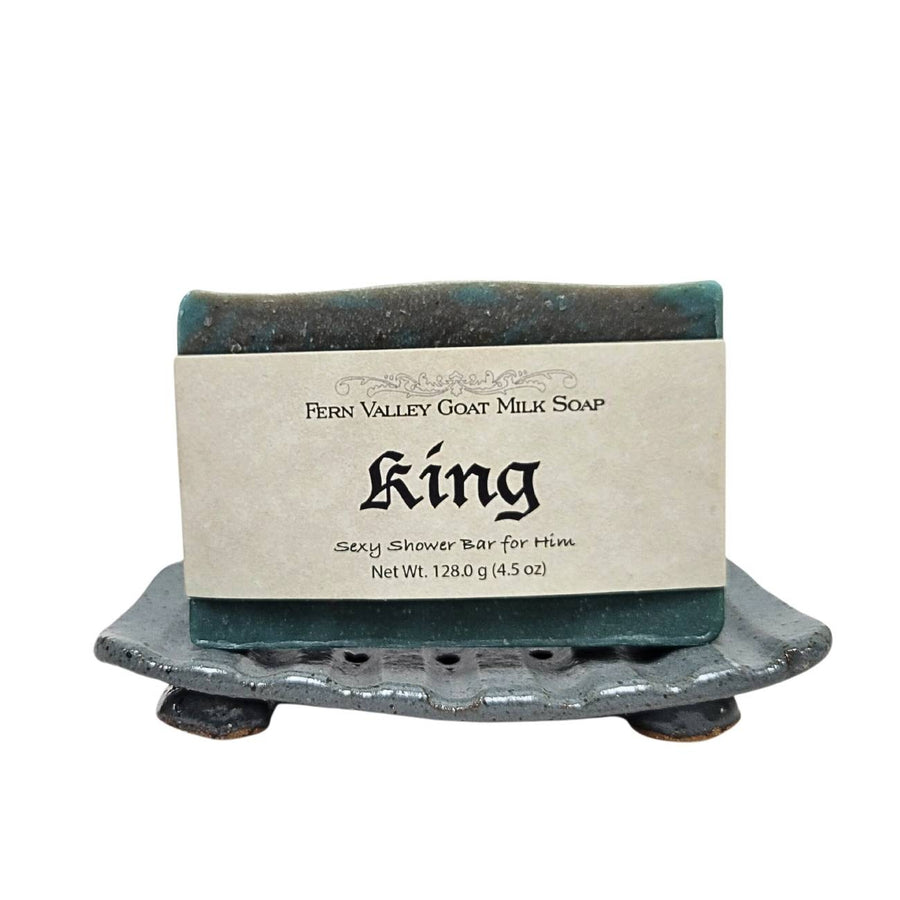 King goat milk soap — bar on a decorative soap dish