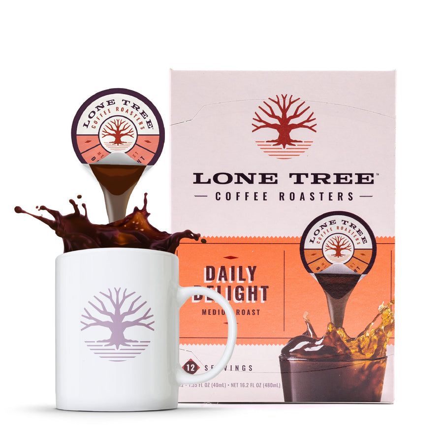 Lone Tree Daily Delight carton beside a mug and pod