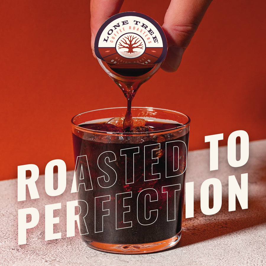 Hand pouring Lone Tree coffee into a glass