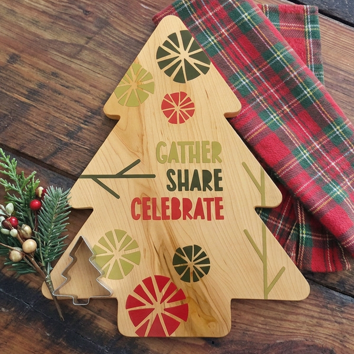 Christmas tree-shaped serving board styled with festive table accessories