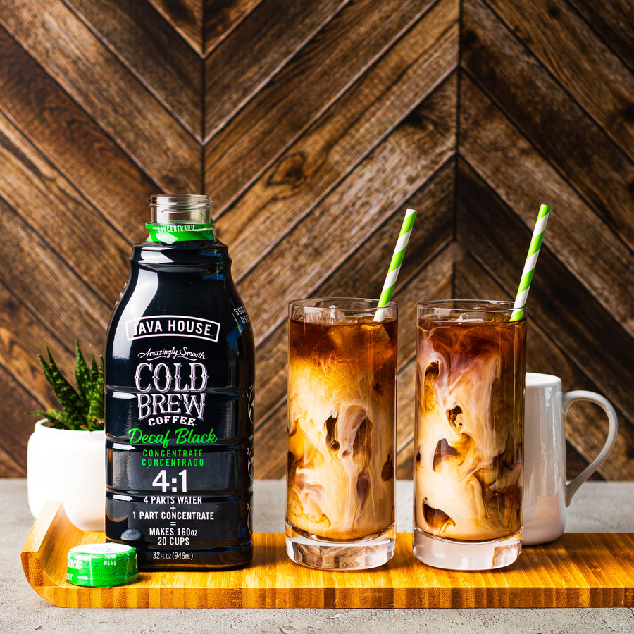 Decaf concentrate bottle beside an iced latte