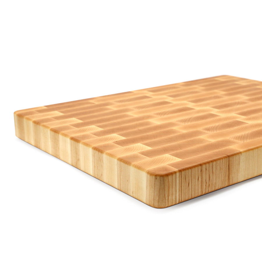 Maple end-grain board with a juice groove and thick side profile