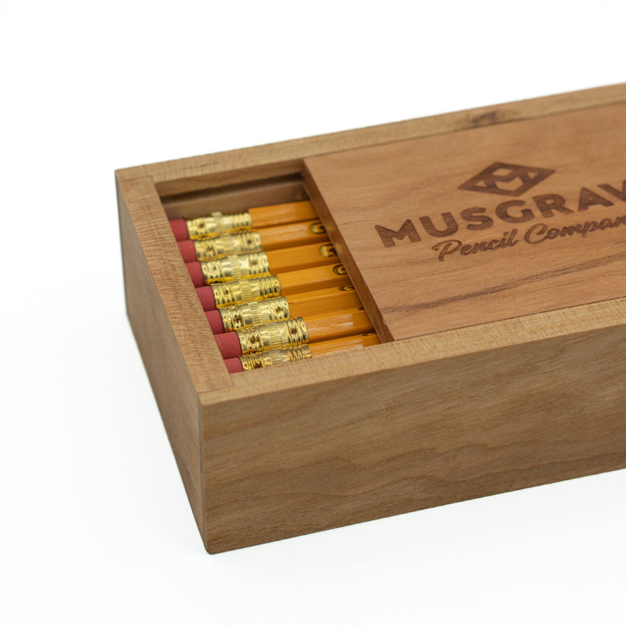 Partly open cherry box showing Harvest Professional pencils and erasers