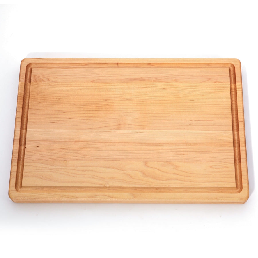 Overhead view of a maple board with a perimeter juice groove