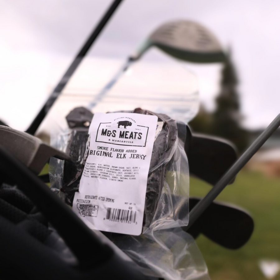 Original Elk Jerky, package beside fishing equipment